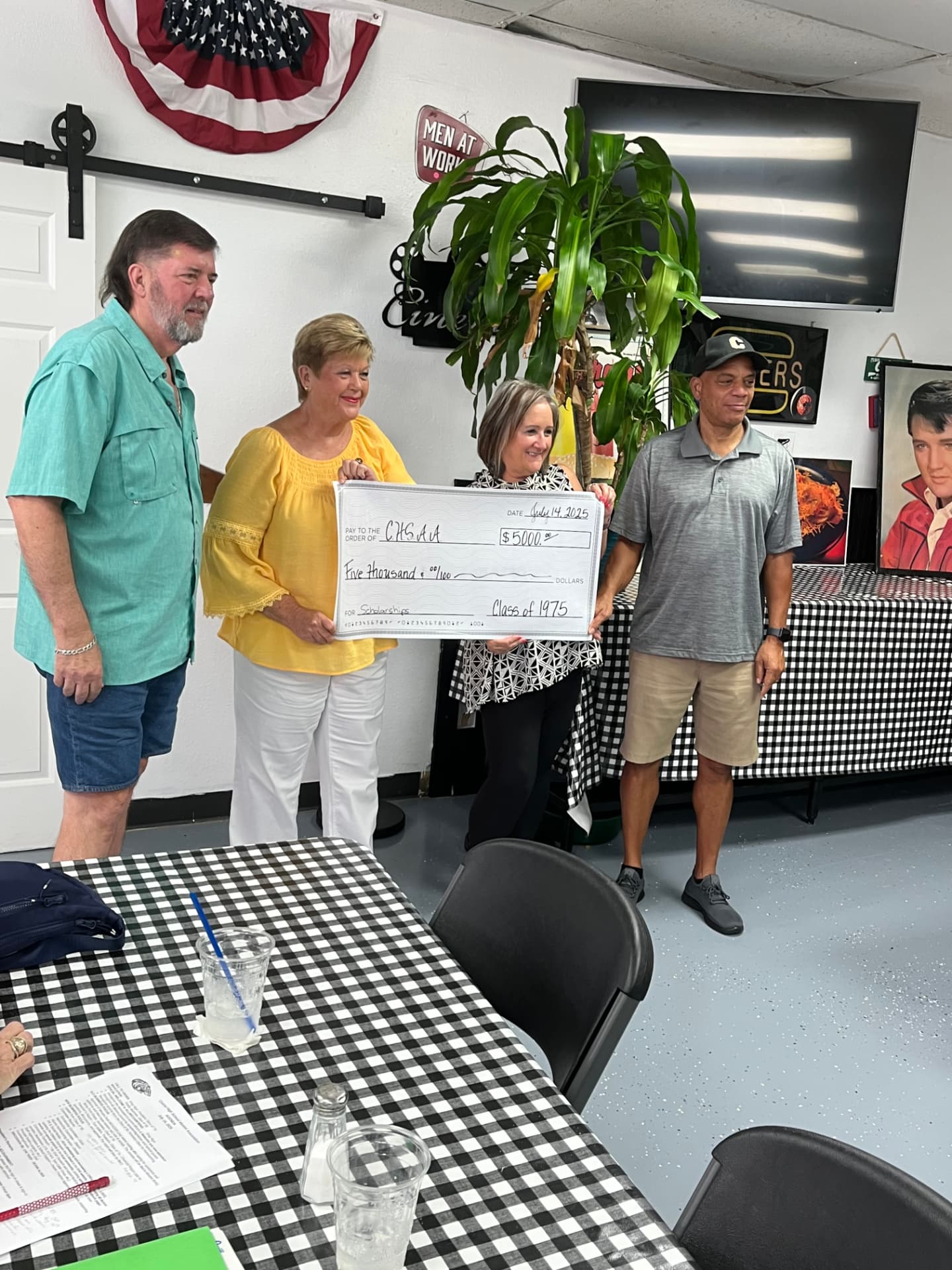 Class of 1975 presents a $5,000 scholarship check to the CHS Alumni Association