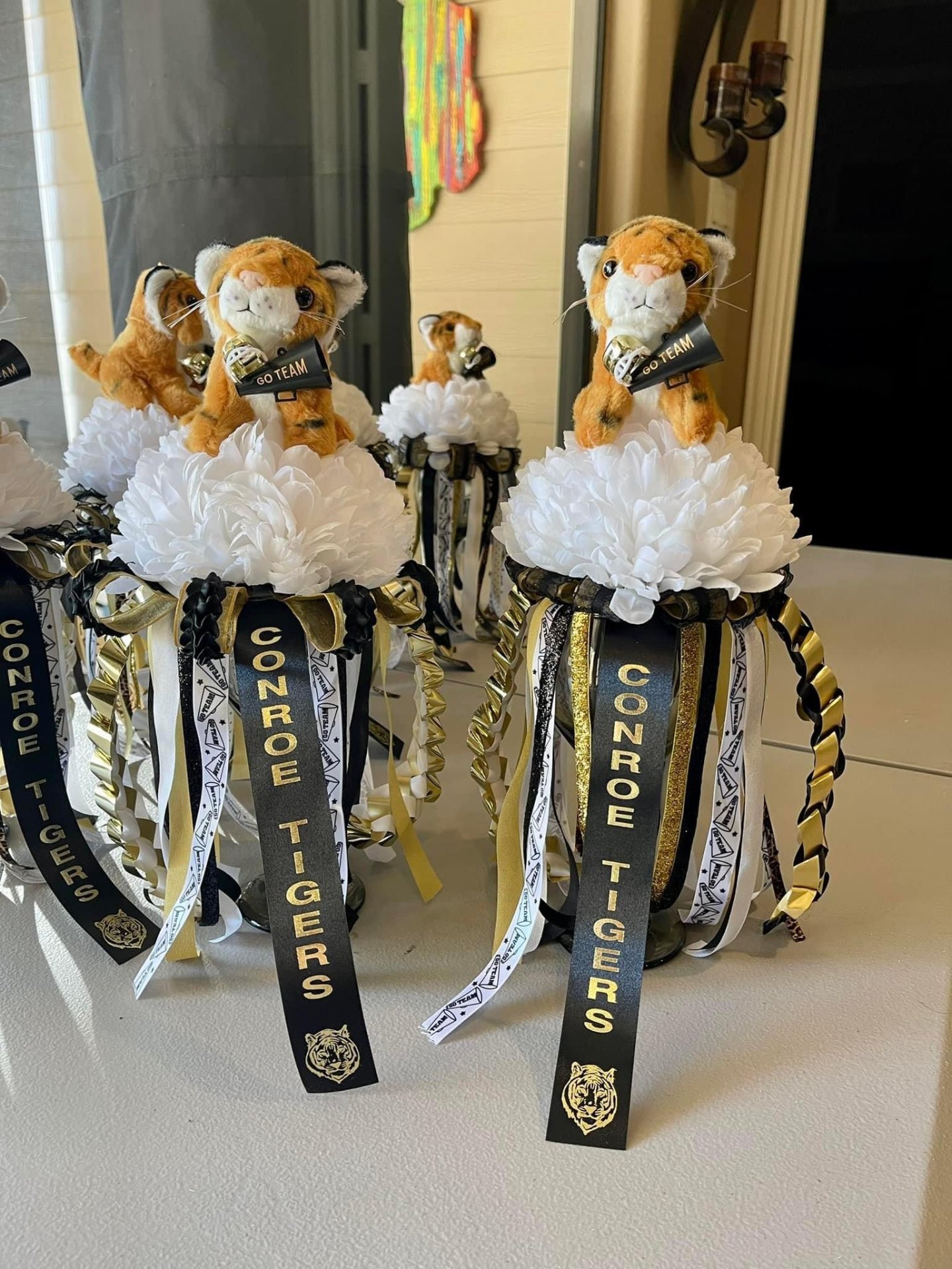 Conroe Tigers homecoming mums with plush tigers